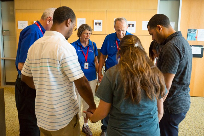 Group prays with chaplains