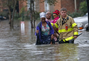 family in floodwaters