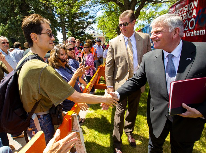 Franklin Graham shaking man's hand, smiling