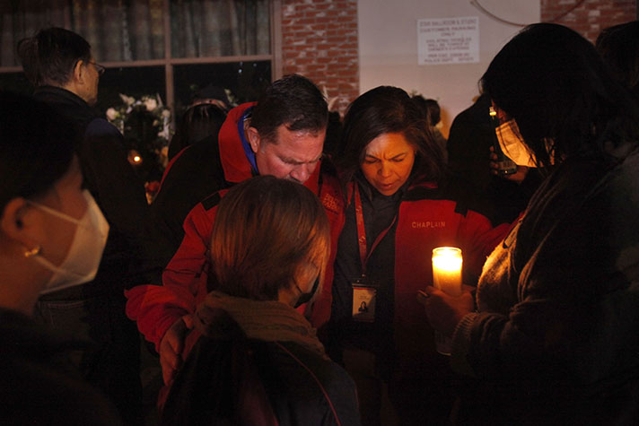  Chaplains pray with locals in Monterey Park, Calif., during a candlelight vigil following a shooting at a dance studio. 