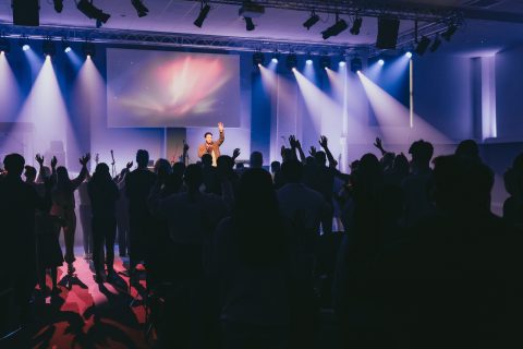 Attendees worshipping