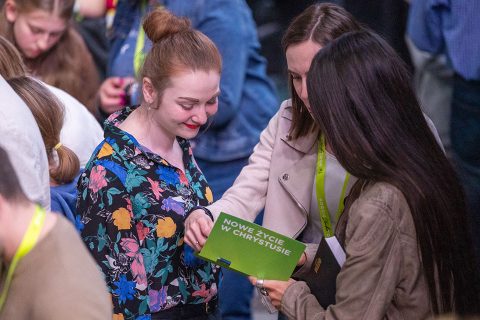 Attendees reading some of the materials provided to people who made a decision for Christ.