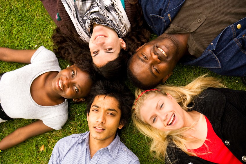 group laying on ground in circle