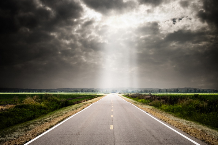 sunlight over road in distance