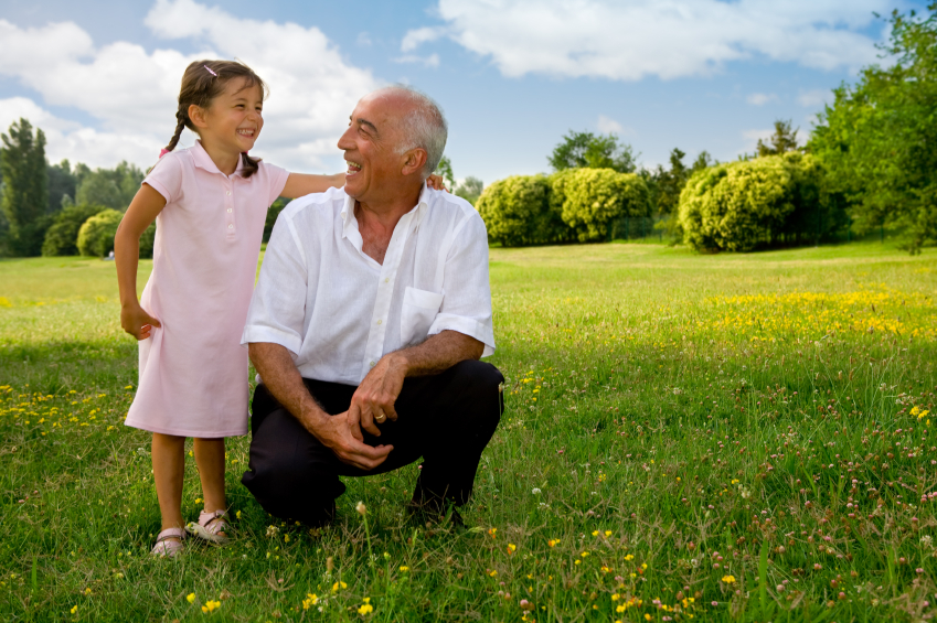girl and grandfather laughing