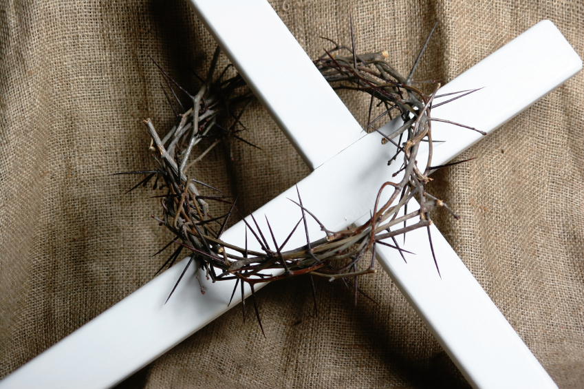 white cross with crown of thorns