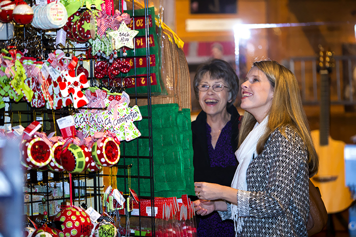 Women browsing ornaments in bookstore