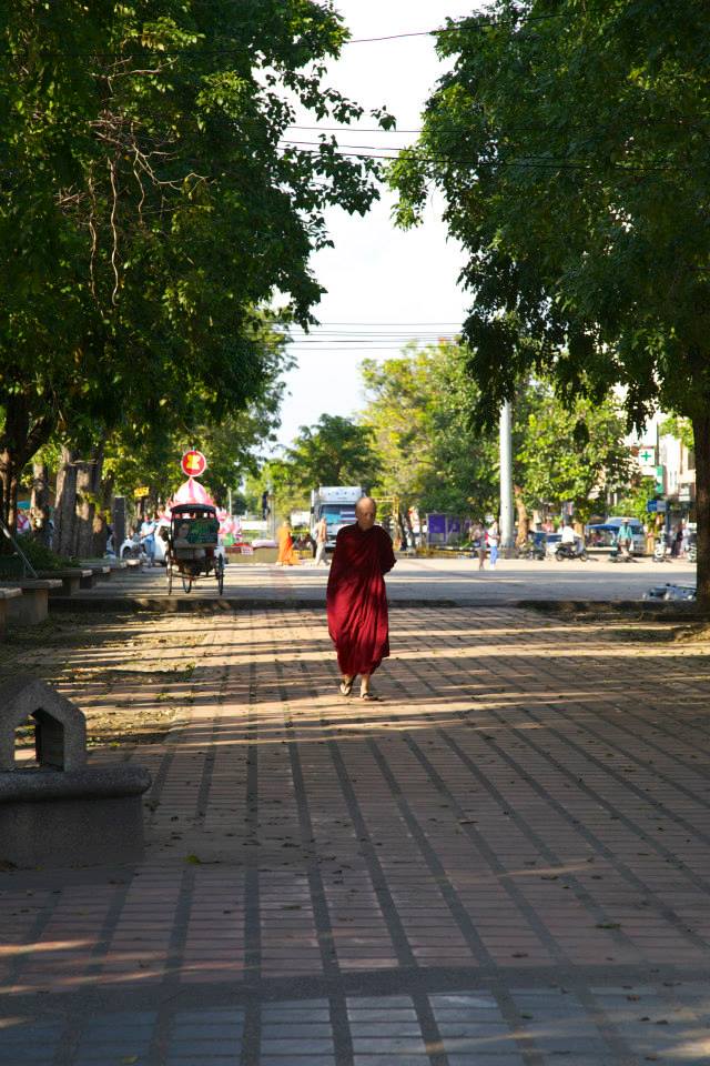 A man walks down the road in Chiang Mai.