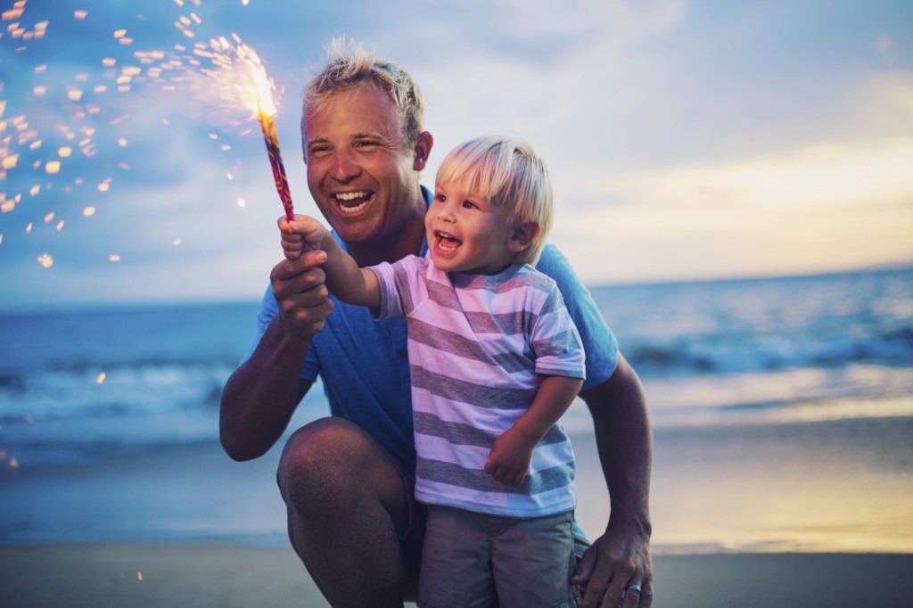 father and son with sparklers