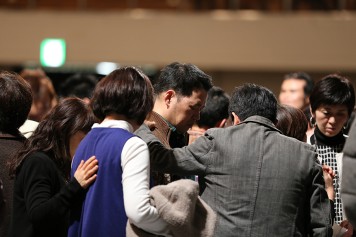 Counselors pray in Fukuoka