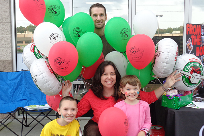 Family with OCC balloons