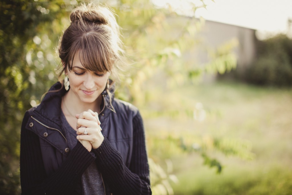 girl praying outside