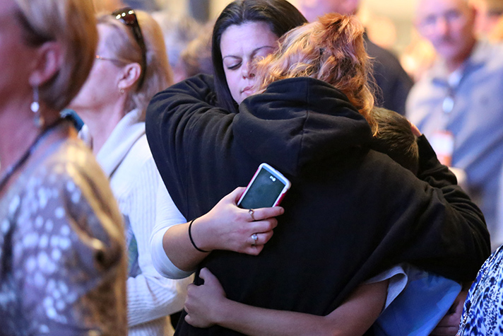 Young women hug