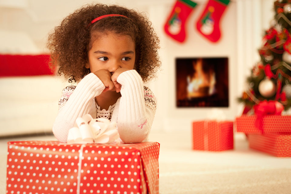 little girl looking sad at Christmastime