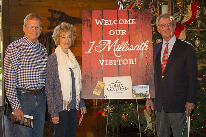 Thomas and Linda Weir with Tom Phillips and 1 millionth visitor sign