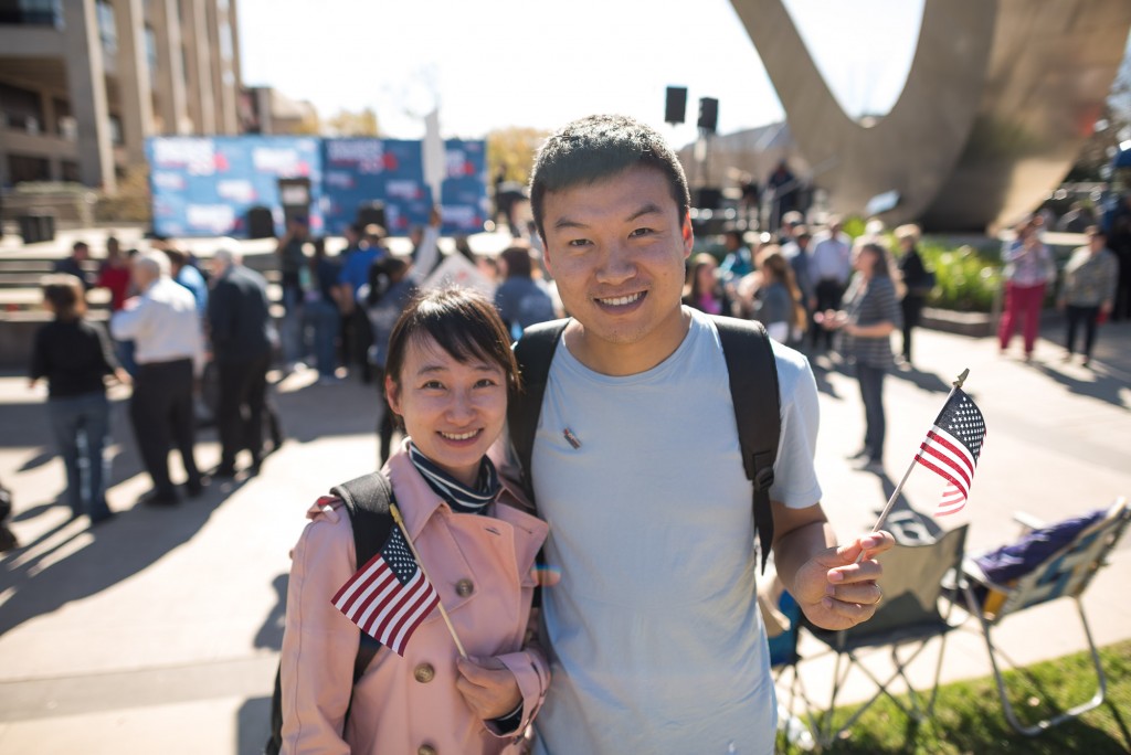 Two young people with flags