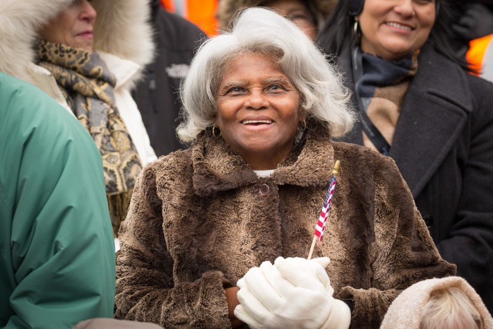 senior woman standing in crowd