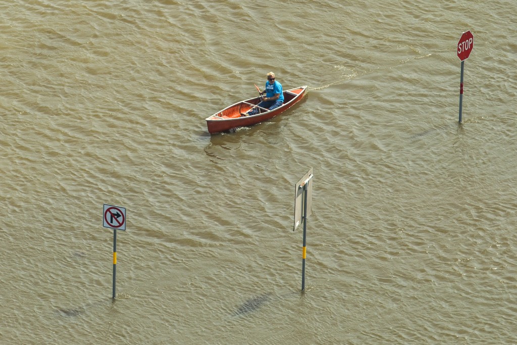 resident in boat in flood