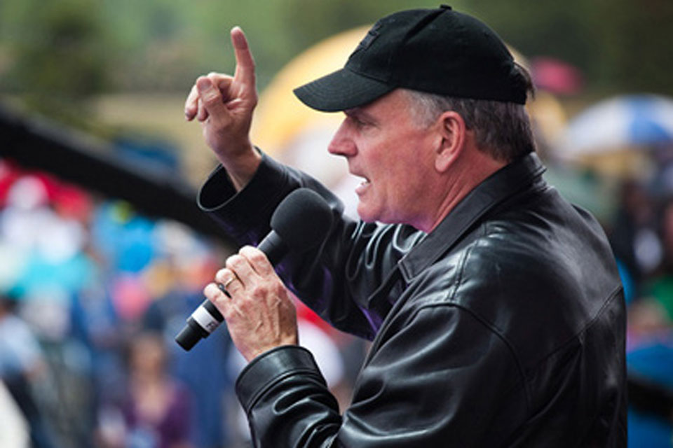 Franklin Graham in leather jacket and baseball cap