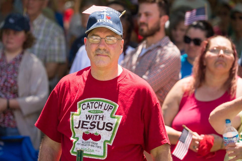 Man in "Catch Up with Jesus" shirt