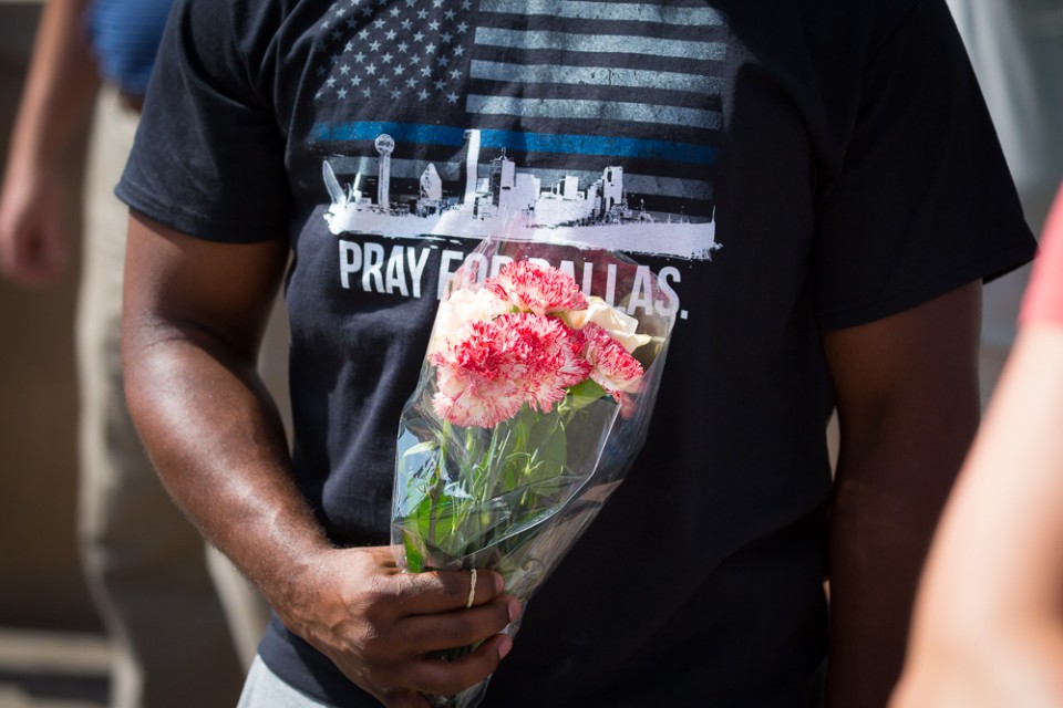 man in "Pray for Dallas" shirt