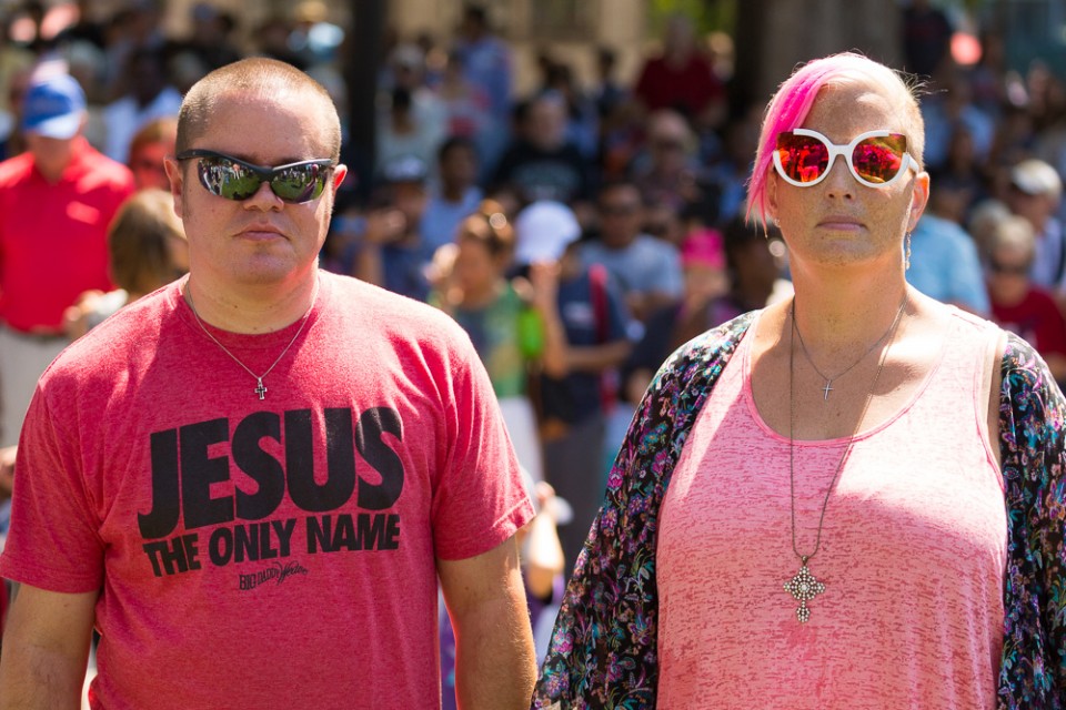 Man in "Jesus is the only name" shirt