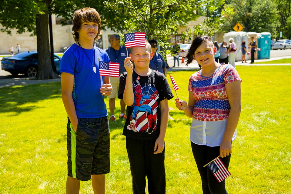 Teens holding American flags