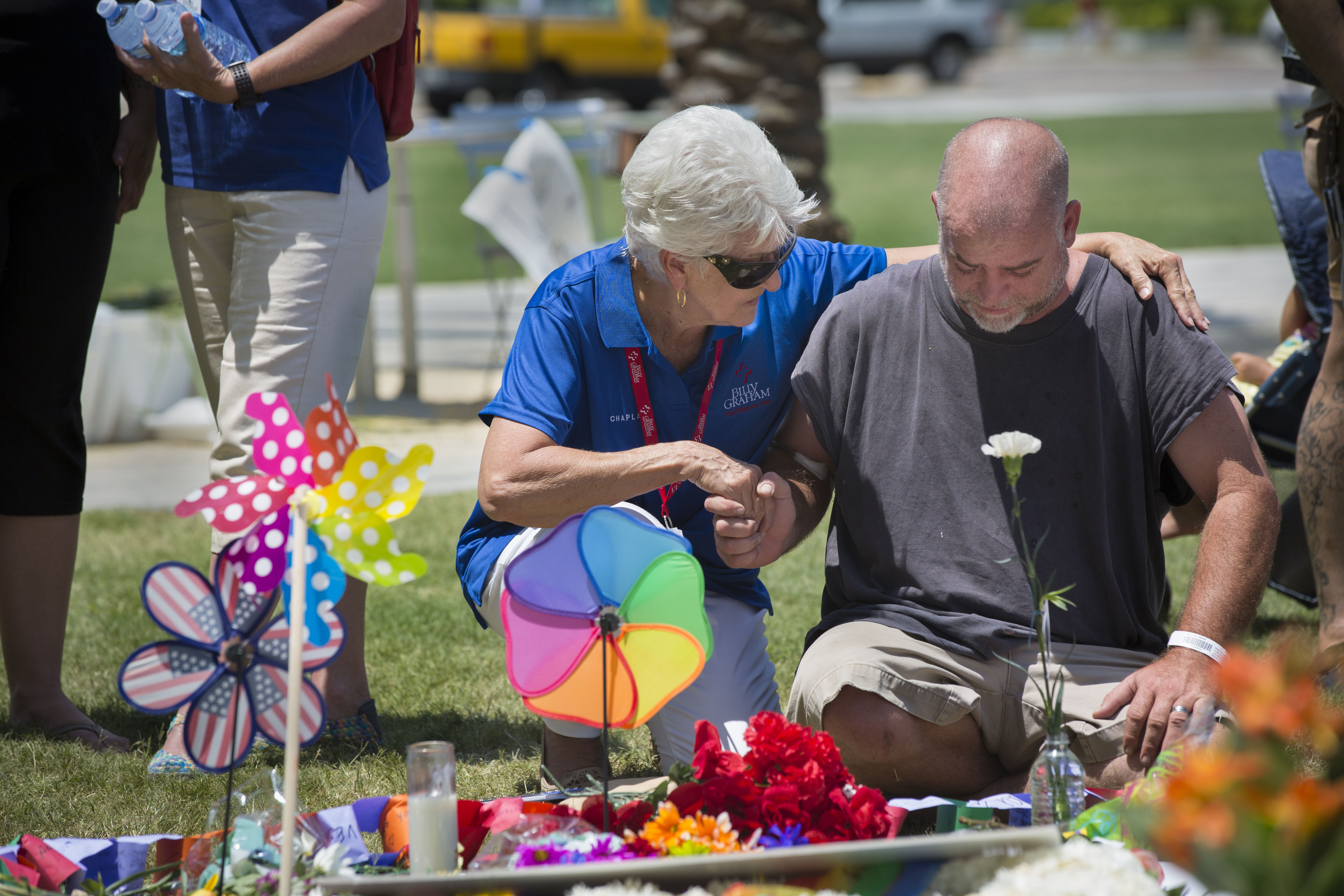 Carol Wheatley praying with the man.