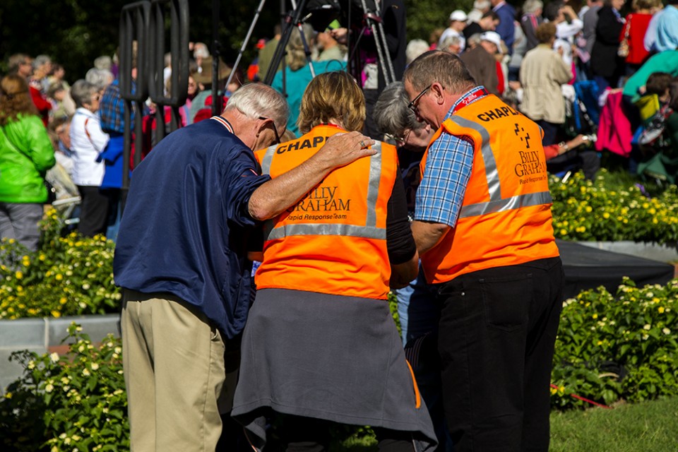 Rapid Response Team Chaplains praying with a person