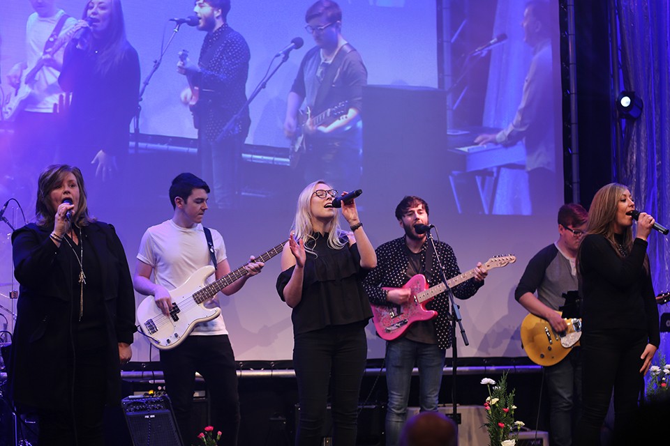 Band performing onstage