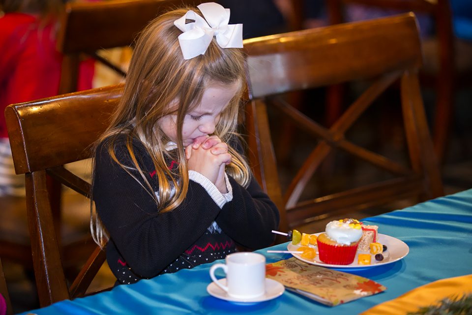 Little girl with hands folded, praying