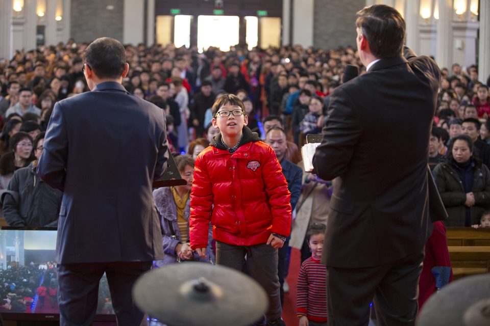 Little boy coming forward at invitation. Will Graham and his interpreter