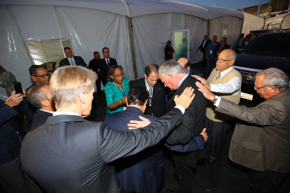 Pastors and others lay hands on Franklin Graham