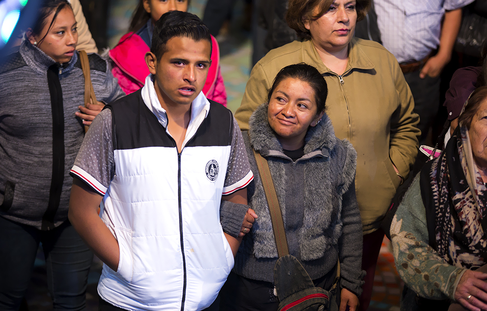 Woman arm in arm with young man