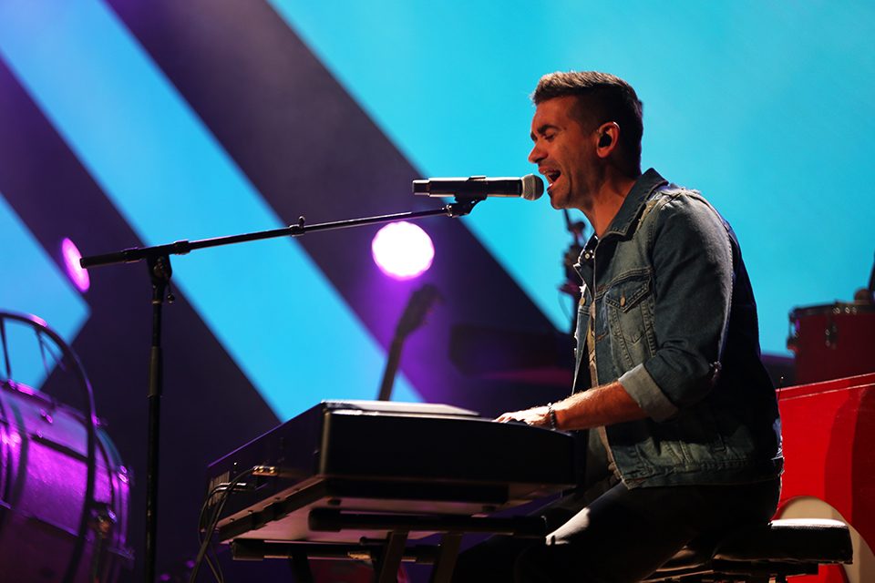 Aaron Shust playing keyboard and singing
