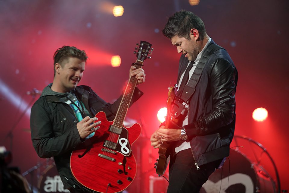 Josh Havens and Matthew Fuqua playing guitars side by side