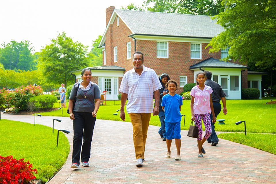 Family walking in together to celebrate Father's Day at the Billy Graham Library.