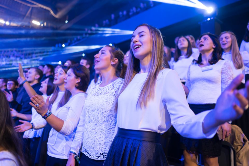 Young girls singing and praising God in the choir