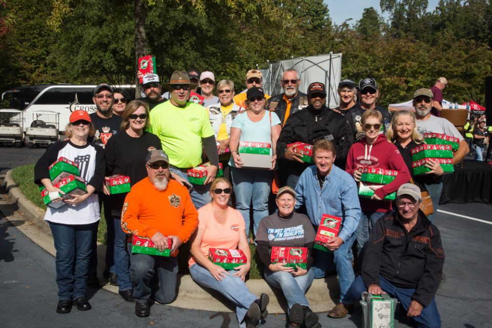Group of people holding OCC shoeboxes