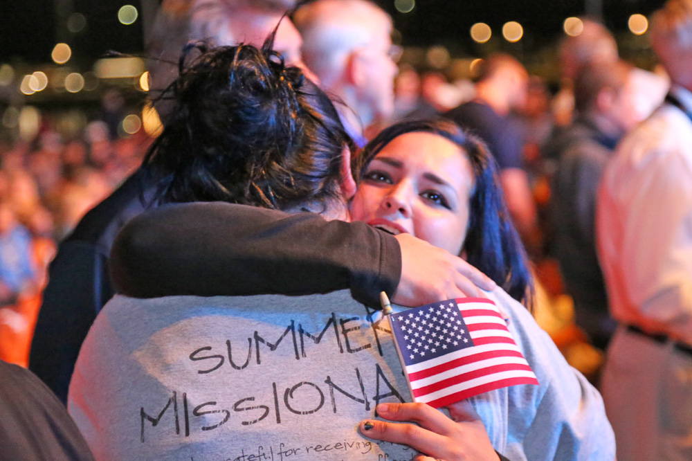 Counselor hugging woman