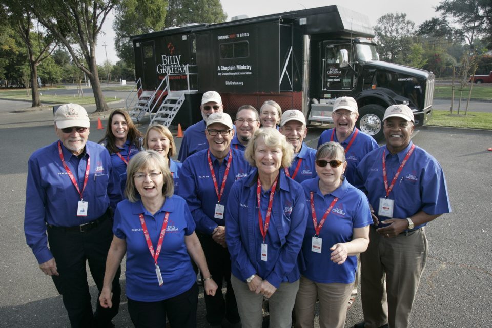 Group picture of Billy Graham chaplains in Santa Rosa standing in front of Rapid Response Team's Mobile Ministry Center