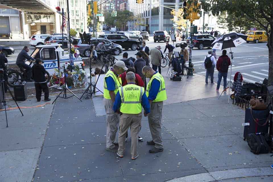 Chaplains circled in prayer near temporary memorial for victims in NYC