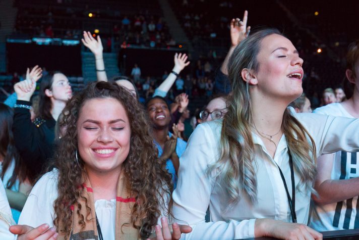 Two young women worshiping