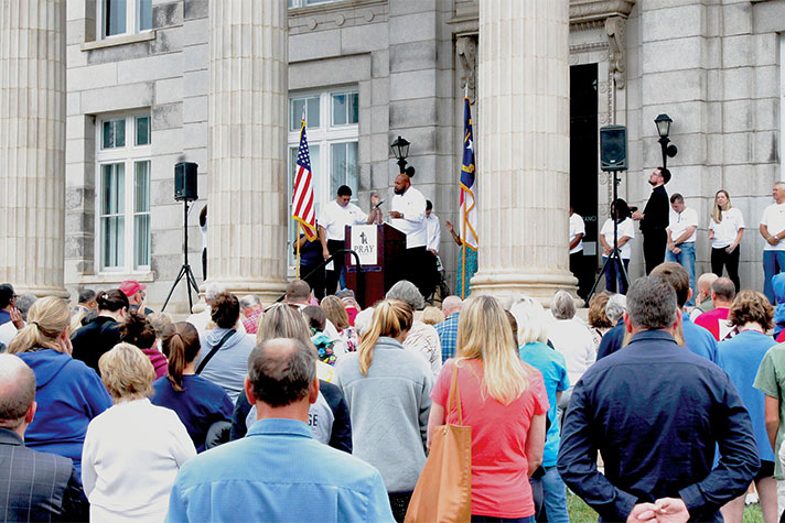 People praying on the steps of Rowan County, NC, courthouse
