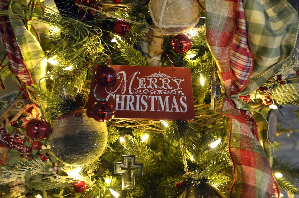Merry Christmas ornament on Christmas tree