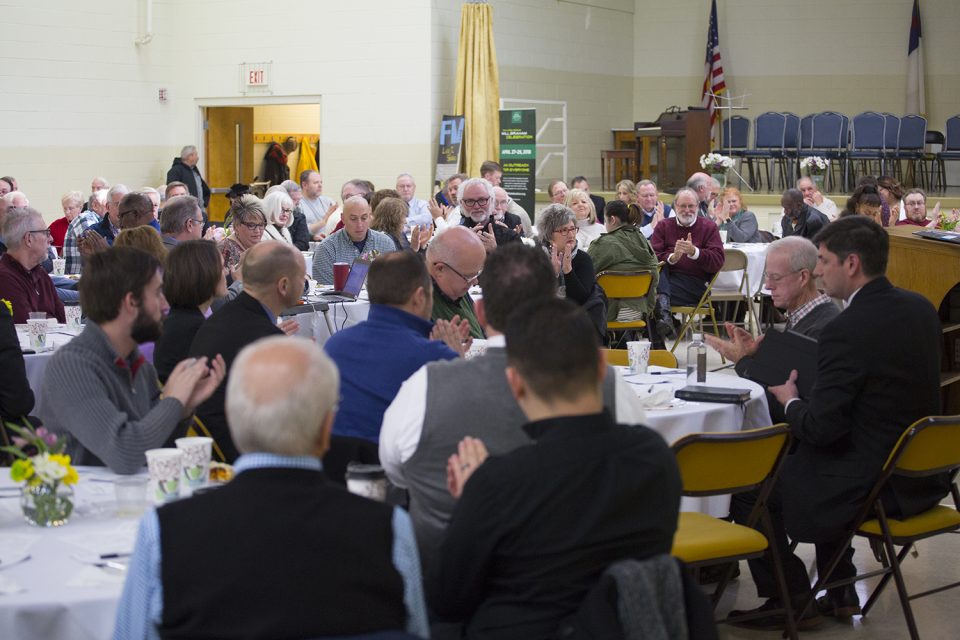 Will Graham and pastors sitting at tables