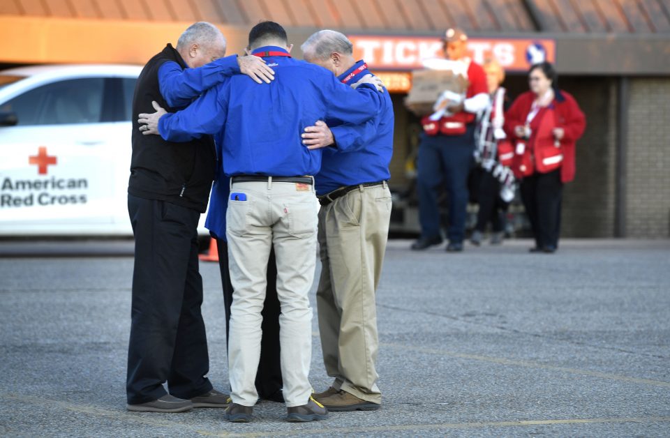 chaplains pray together outside high school