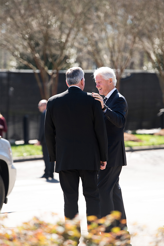 President Clinton pats Franklin Graham's shoulder