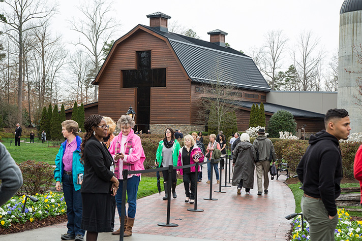 People streaming in front of the Billy Graham Library