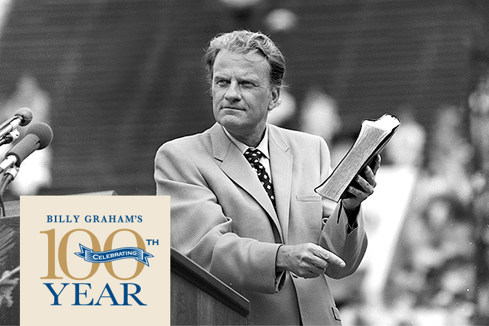 Billy Graham holding Bible